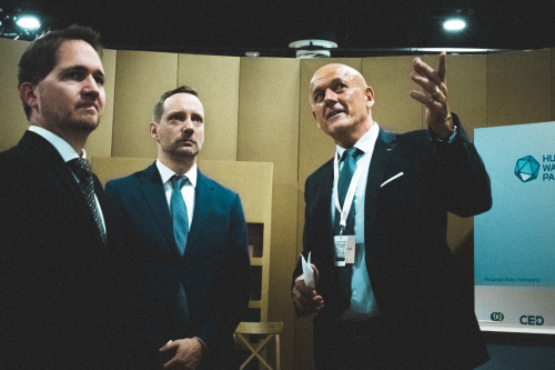 Mr. Péter Kovács - CEO of the Hungary Helps Agency (left), Mr. Tristan Azbej - State Secretary for the Aid of Persecuted Christians (center) and Dr. Károly Kovács - president of the HWP (right) at the HWP booth. Photo: Gábor Bakó & Zsombor Egri